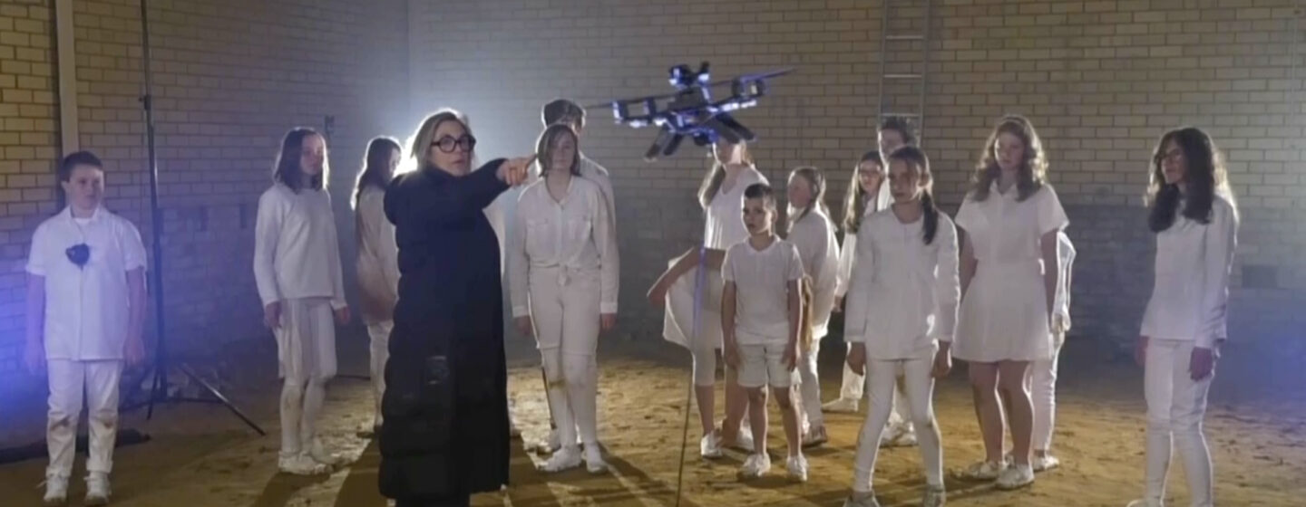 Anne Scott Wilson and Cameron Bishop's performance involving children dressed in white with autonomous drones.
