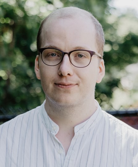 Man with glasses and smiling