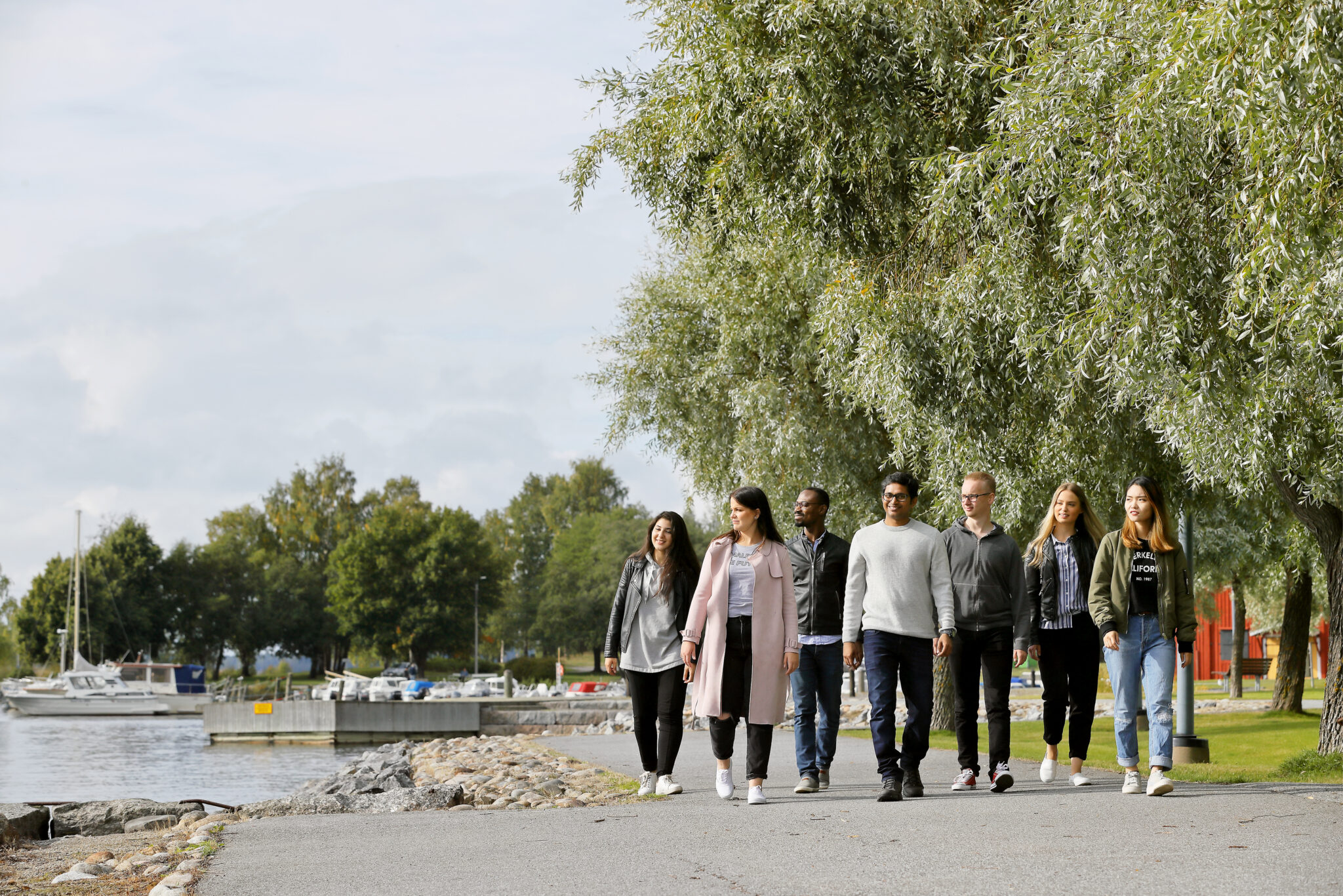 students walking on the shore